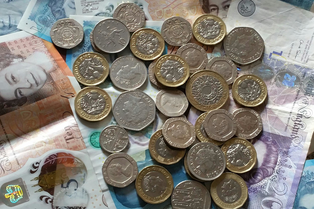 Photo of money both coins and notes.